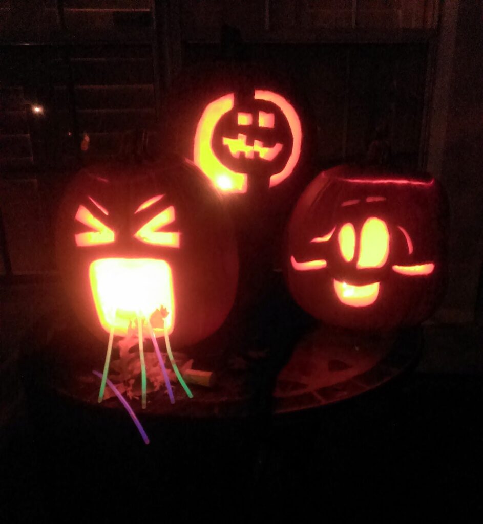 Carved pumpkins with glow sticks