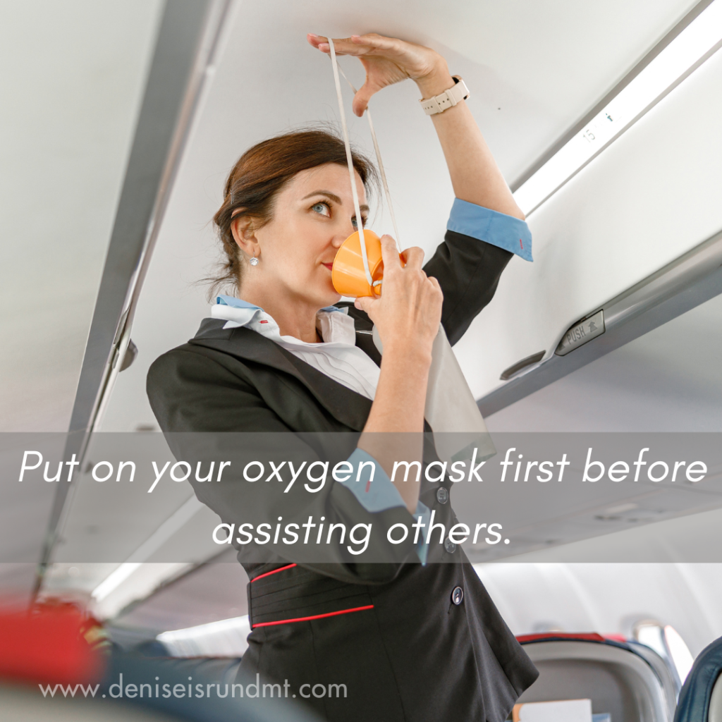 Flight attendant demonstrates placing oxygen mask over face.